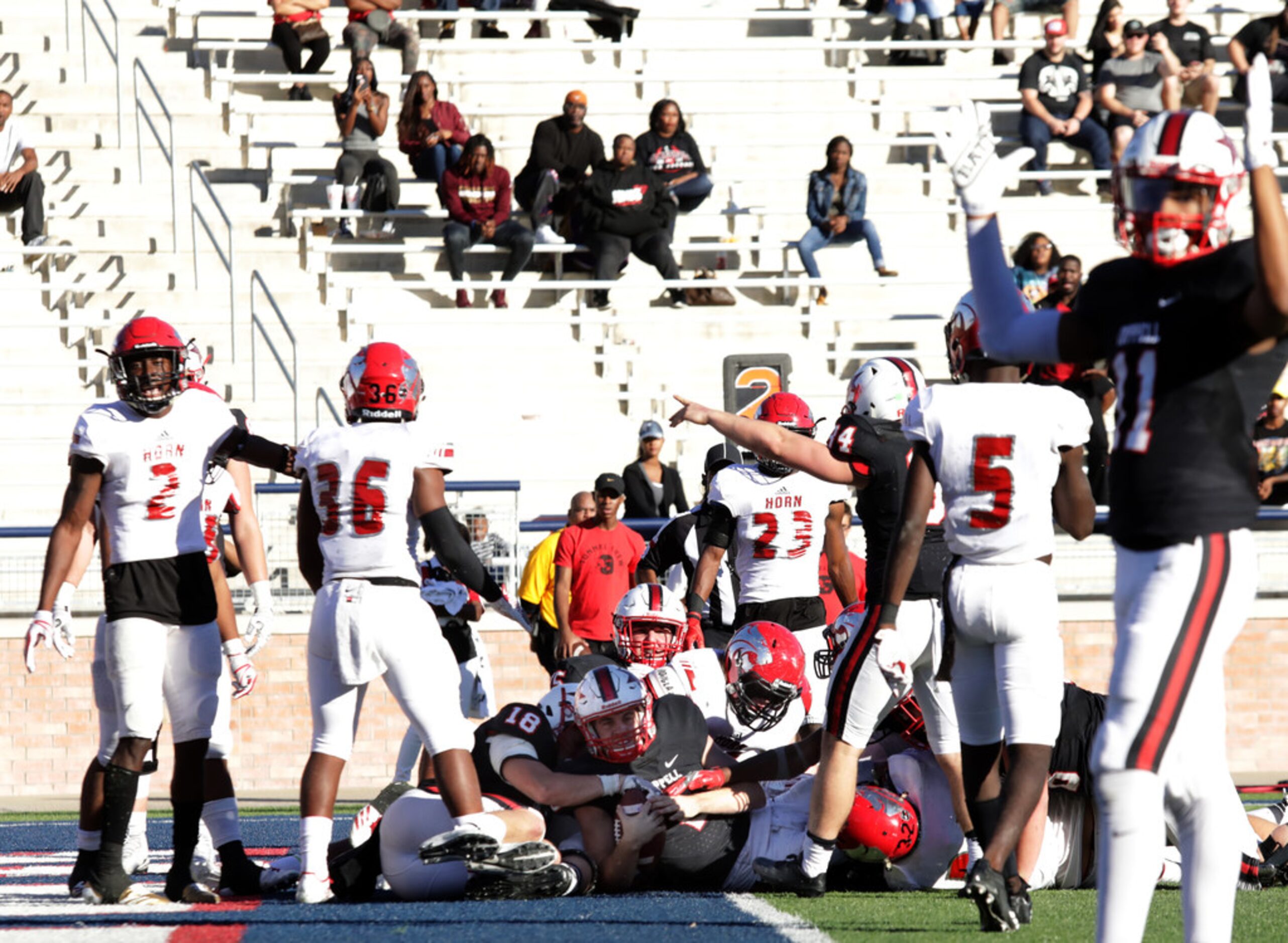 Coppell player 2, Brady McBride, runs in a touchdown during a Class 6A division I playoff...