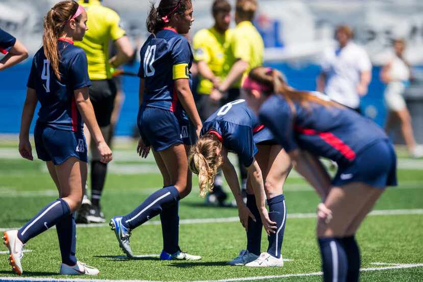 Allen players react to a 2-0 loss after a UIL conference 6A girls state semifinal soccer...