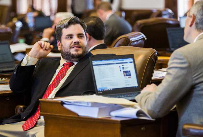 Then-state Rep. Jonathan Stickland, R-Bedford (left) talked to Rep. Scott Sanford,...