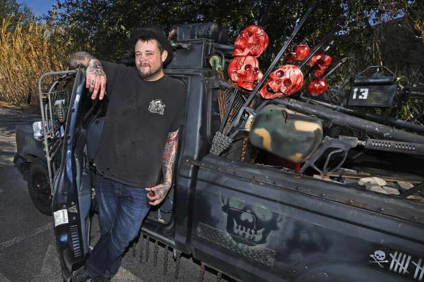 Ace Cordell poses with his truck in Dallas, which he has transformed into a zombie killing...