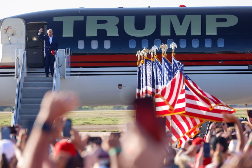 Former President Donald Trump waves towards the crowd as he arrives at his first 2024...