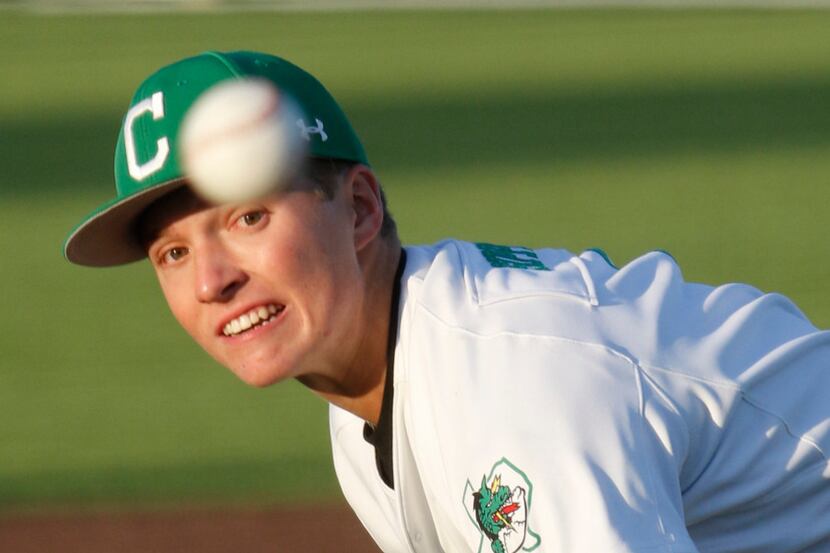 Southlake pitcher Cutter Sippel (4) watches his pitch toward a Flower Mound Marcus batter in...