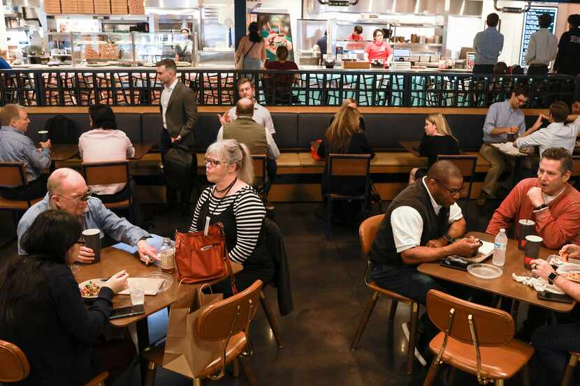 Some of the restaurateurs who run food stands at the Exchange Hall on AT&T's campus in...