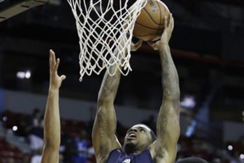 Dallas Mavericks' Chane Behanan goes up for a dunk against Chicago Bulls' Denzel Valentine...