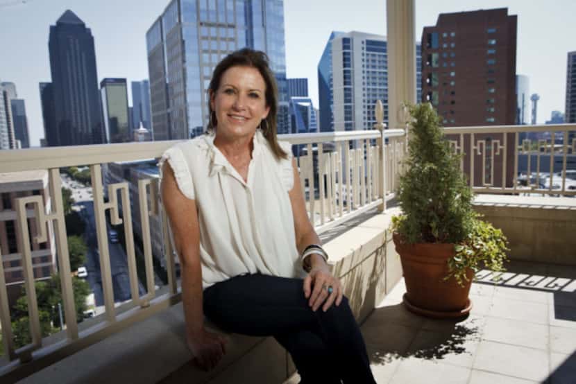 Linda Owen poses for a portrait on the balcony at her home overlooking downtown on Sept. 21,...