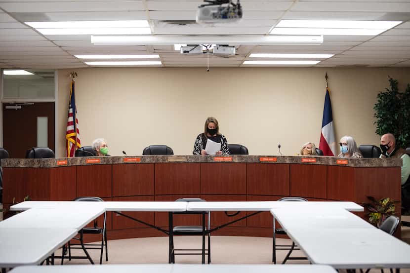 A Kemp ISD board president Charissa Roberts, center, prepares to conduct a board meeting at...