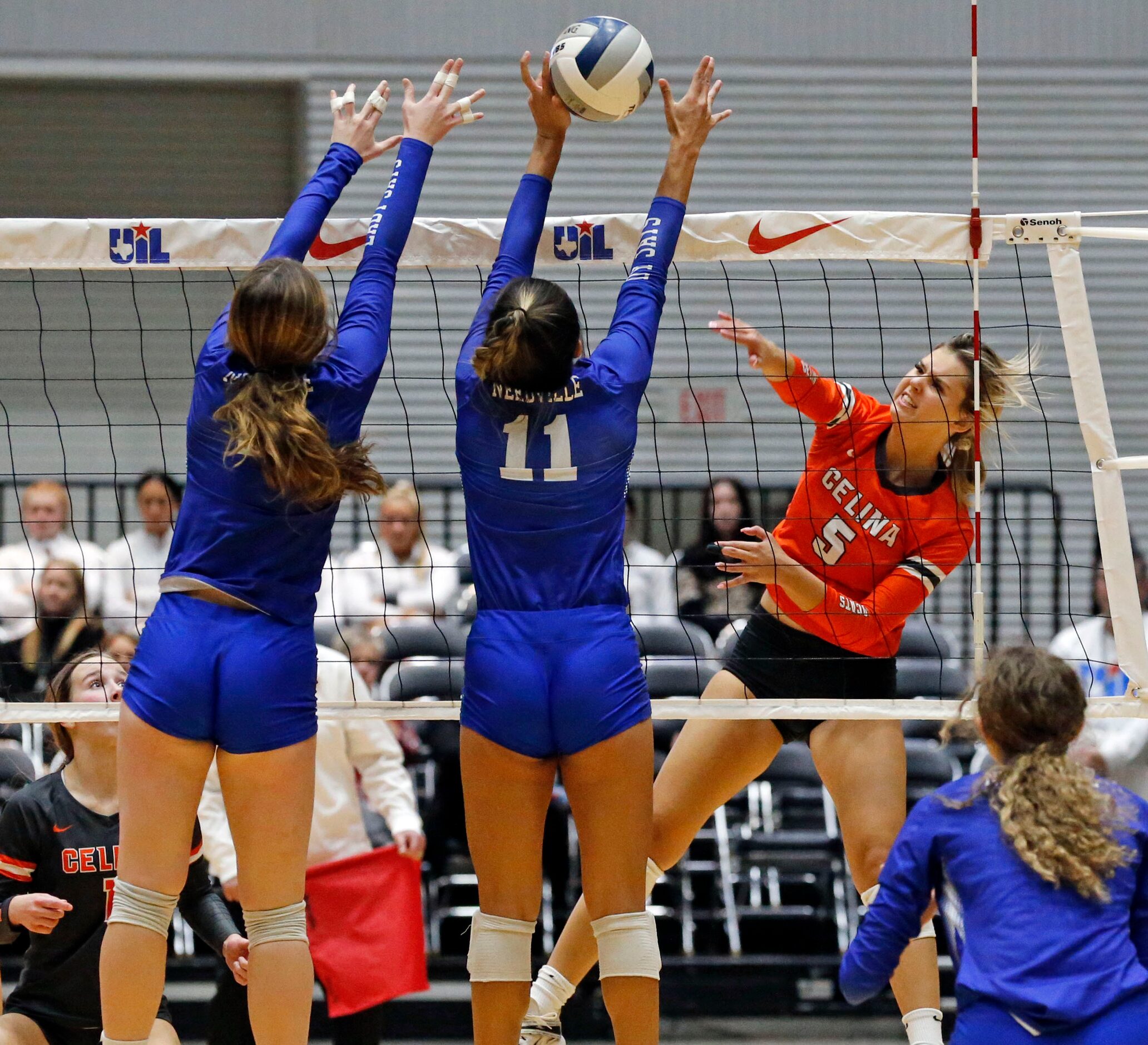 Celina's Lexi Manning (5) fires a shot over two Needville high defenders, including...