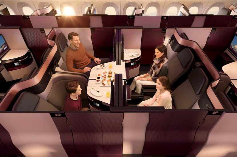 Four passengers traveling together can drop the interior partitions in the Qsuite middle...
