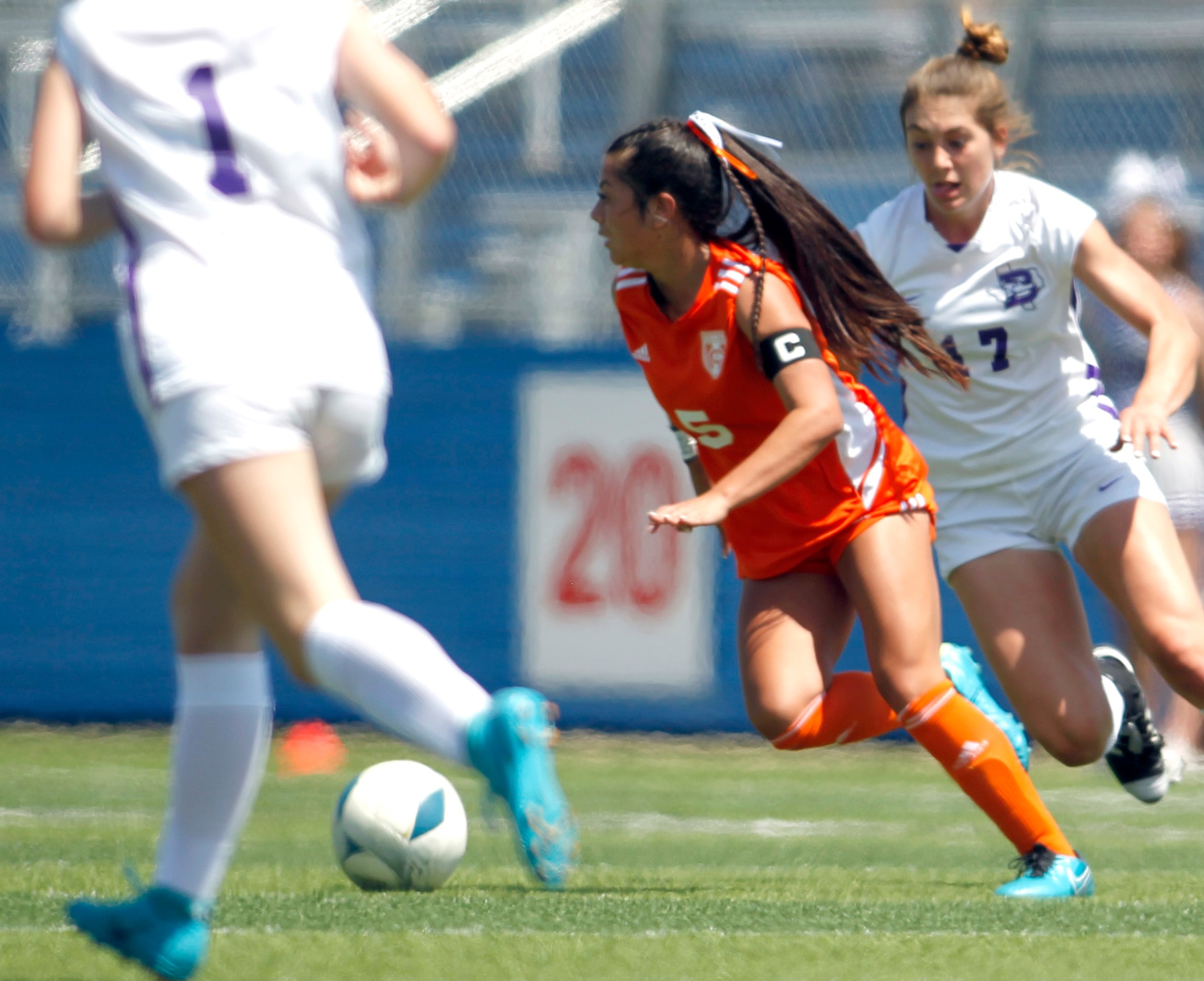 Celina's Brielle Buchanan (5) splits a pair of Boerne defenders during a second half...