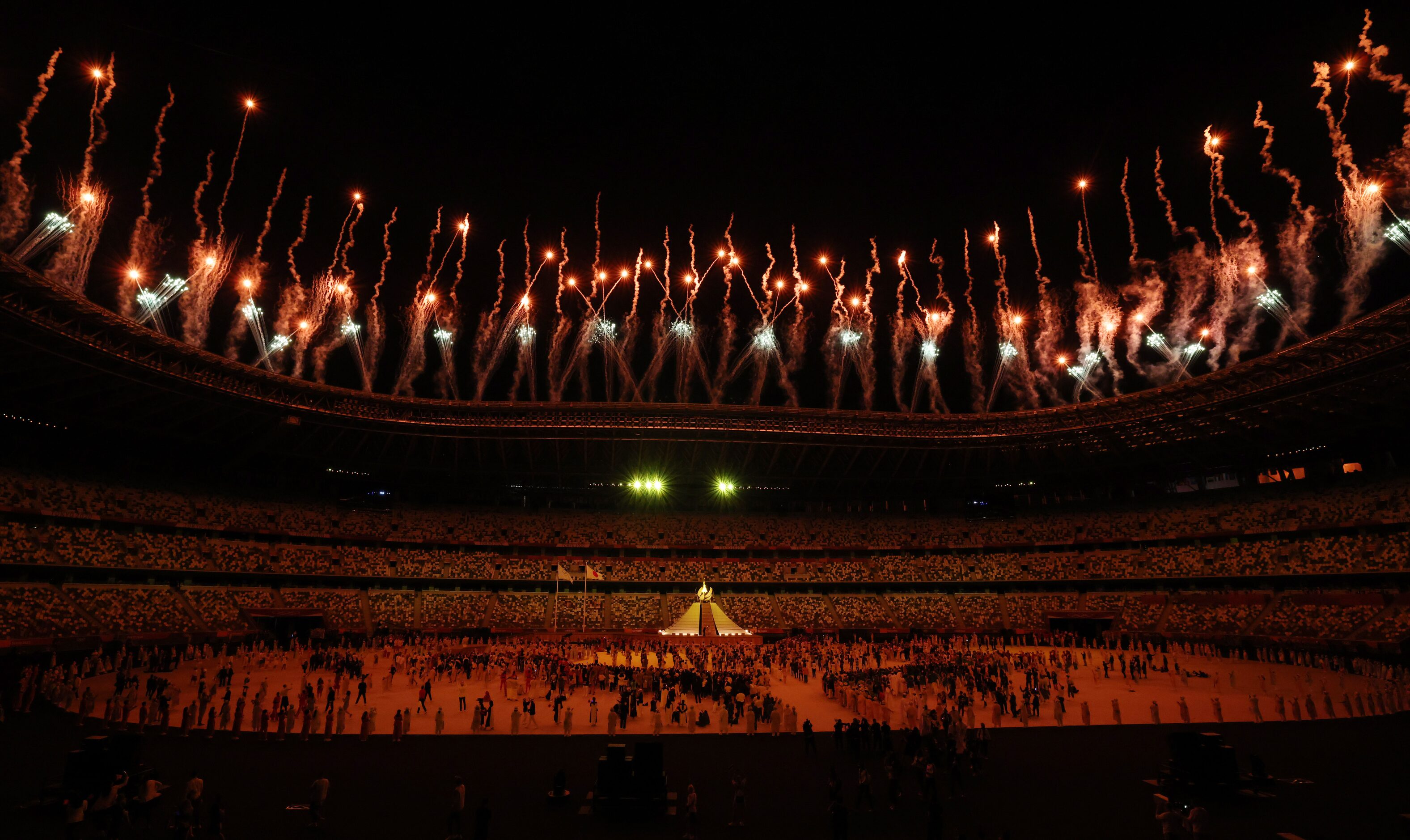 Fireworks go off after the Olympic cauldron was lit during the opening ceremony for the...