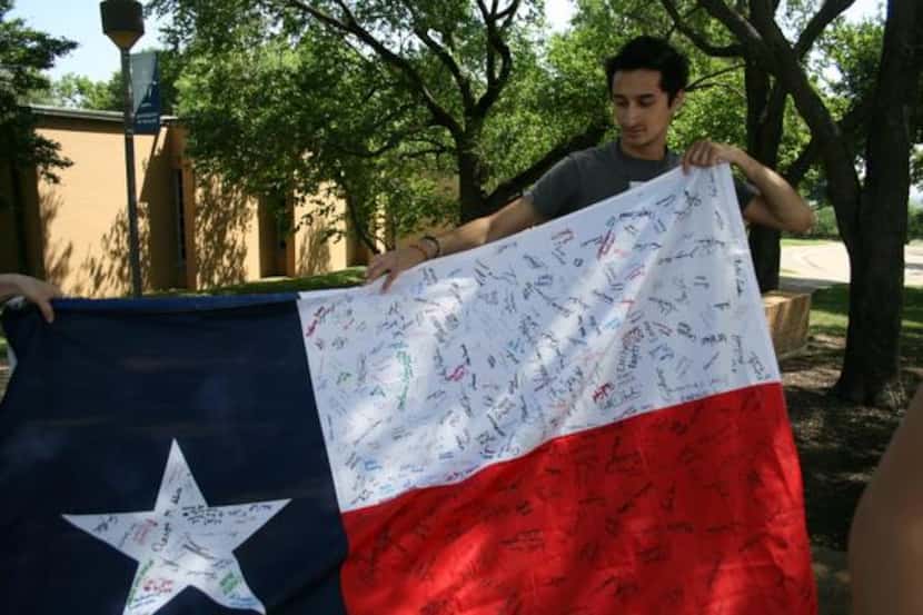 
Alex Taylor holds a Texas flag that will be sent to Pope Francis as part of the student...