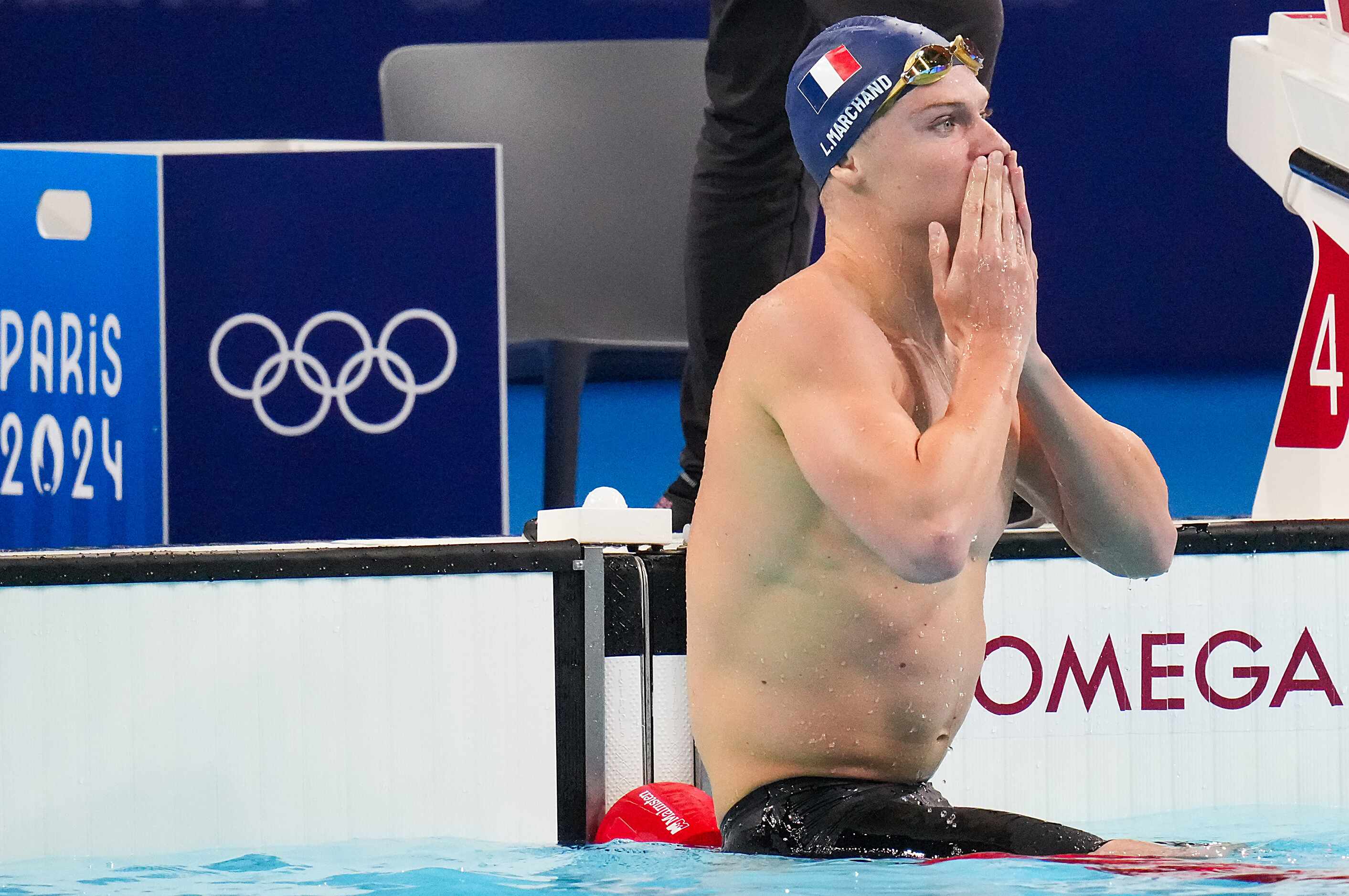 Leon Marchand of France reacts after winning the men's 400-meter individual medley final at...