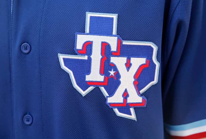 Detail of the Texas Rangers spring training jersey on display during the unveiling of the...