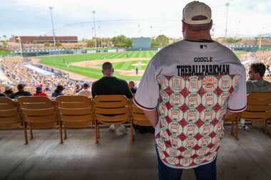 Fan Tom Kimbro wears a jersey marking off all of the MLB ballparks he has visited as he...