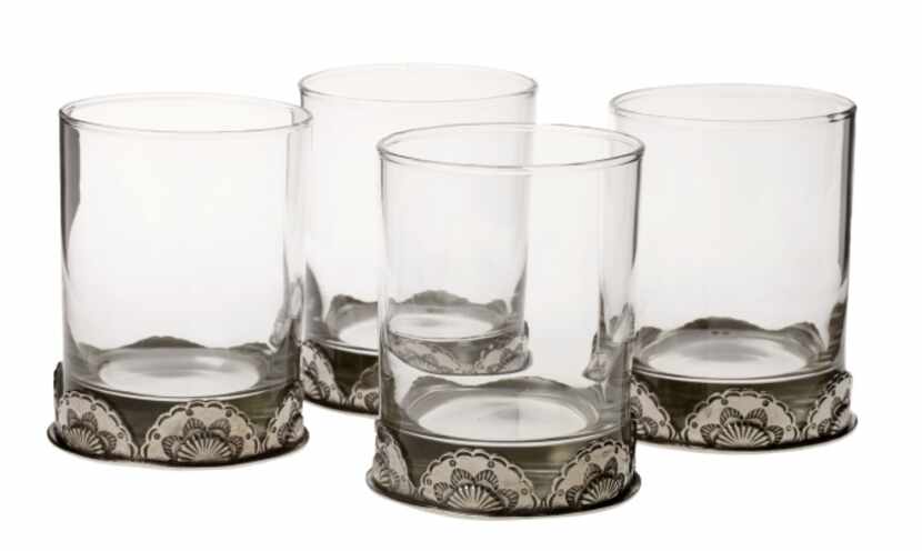 Double old-fashioned glasses are accented with a cast-pewter base. $189 for four at Anteks...