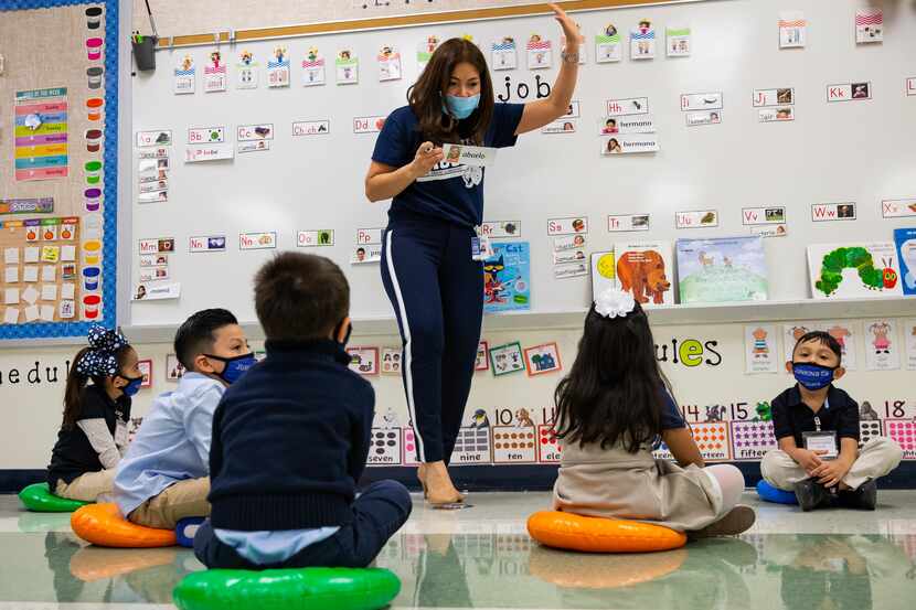 Jerry R. Junkins Elementary teacher Alma Andrade teaches her class as students are spaced...