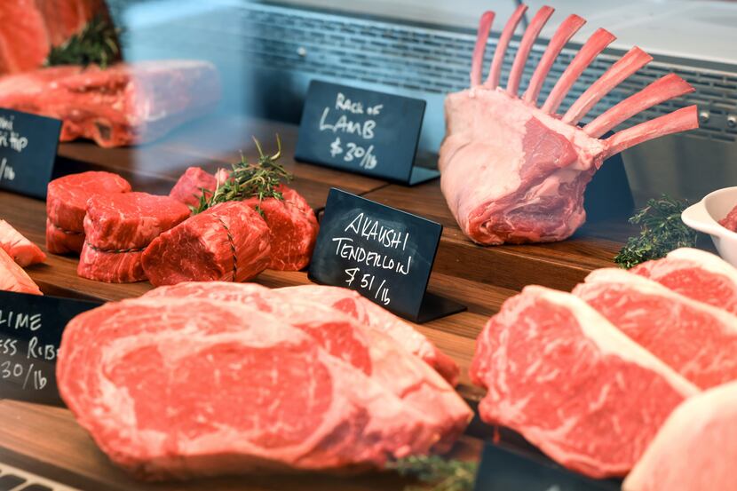 A rack of lamb and cuts of beef greet customers when they walk into Evan's Meat Market,...