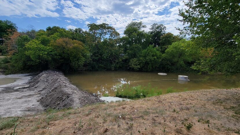 Earthen dam at Wynne Creek. The EPA said dams were constructed to mitigate the spread of...