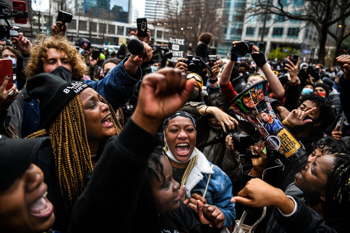 People celebrate as the verdict is announced in the trial of former police officer Derek...