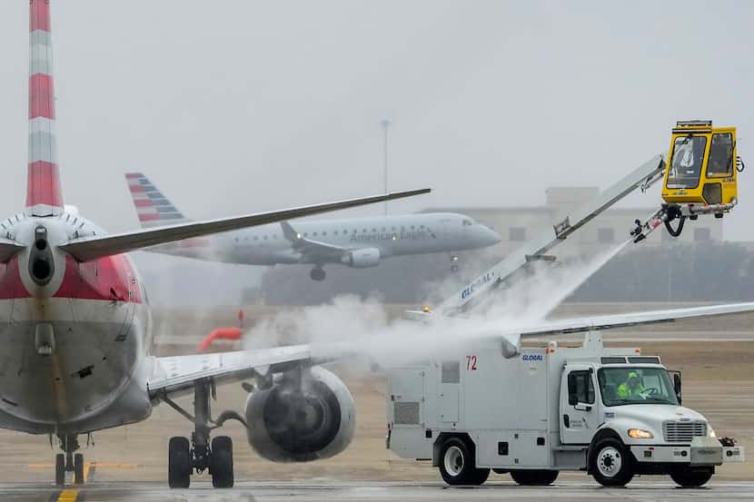 An American Airlines jet undergoes deicing procedures on Monday, Jan. 30, 2023, at DFW...