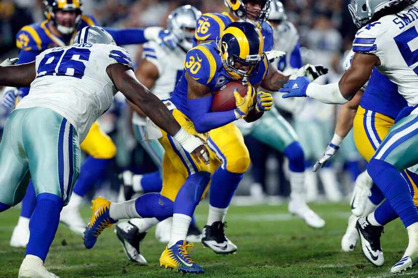 Los Angeles Rams running back Todd Gurley (30) carries the ball against the Dallas Cowboys...