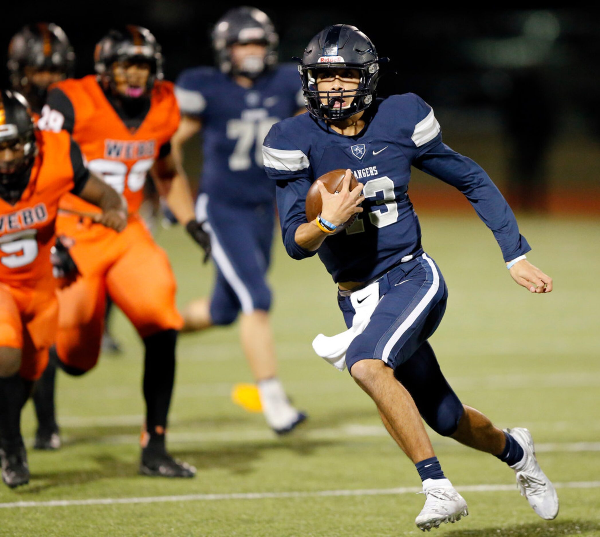 Frisco Lone Star quarterback Garrett Rangel (13) carries the ball against Lancaster during...