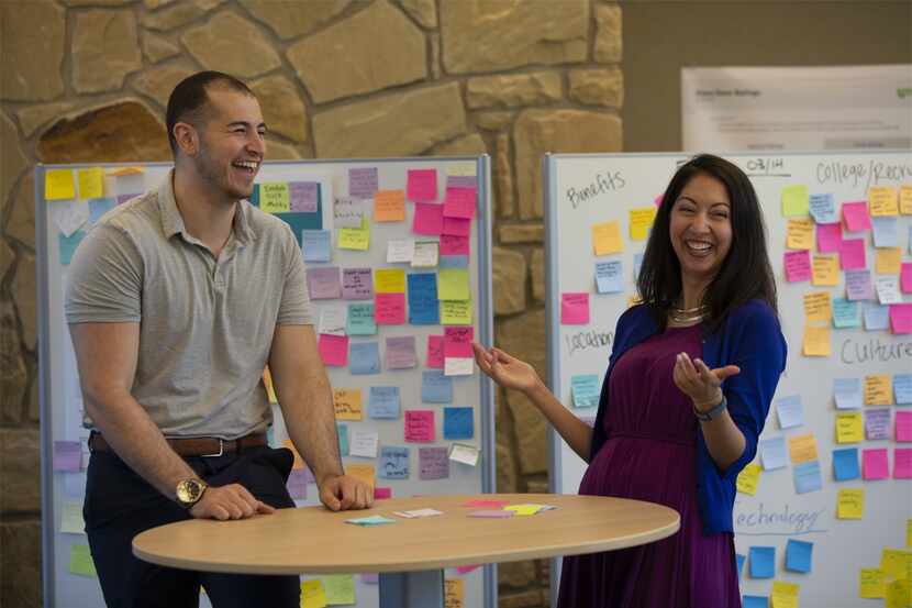 Fidelity Investments workers conduct a brainstorming session at its campus in Westlake.