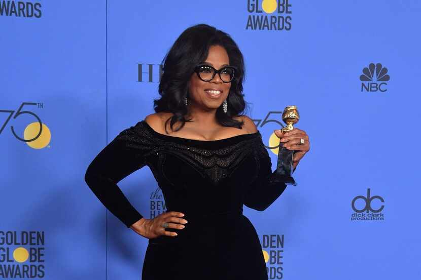 Oprah Winfrey with the Cecil B. DeMille Award during the 75th Golden Globe Awards in Beverly...