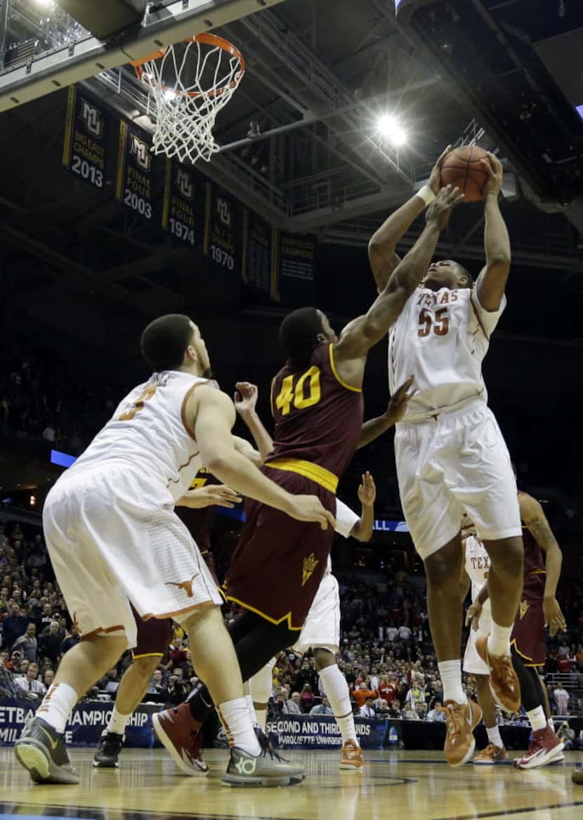 Texas center Cameron Ridley (55) goes up for the game-winning shot against Arizona State...