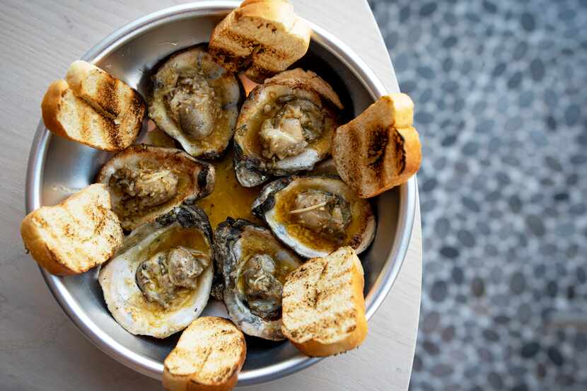 Chargrilled oysters are on the menu at Krio restaurant in the Bishop Arts District.