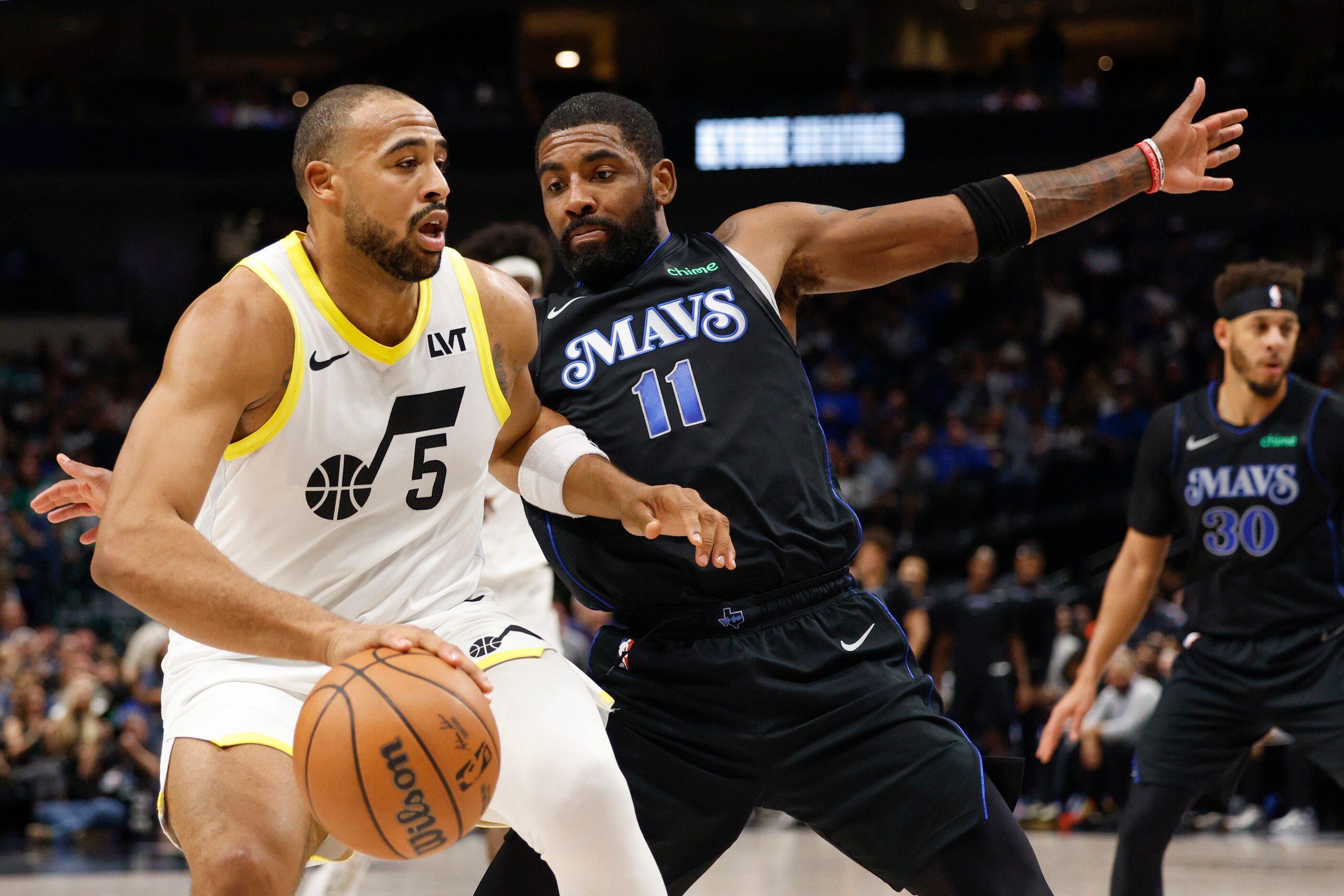 Dallas Mavericks guard Kyrie Irving (11) defends against Utah Jazz guard Talen Horton-Tucker...