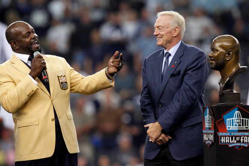 Former Dallas Cowboy Emmitt Smith acknowledges his old boss Jerry Jones during a halftime...