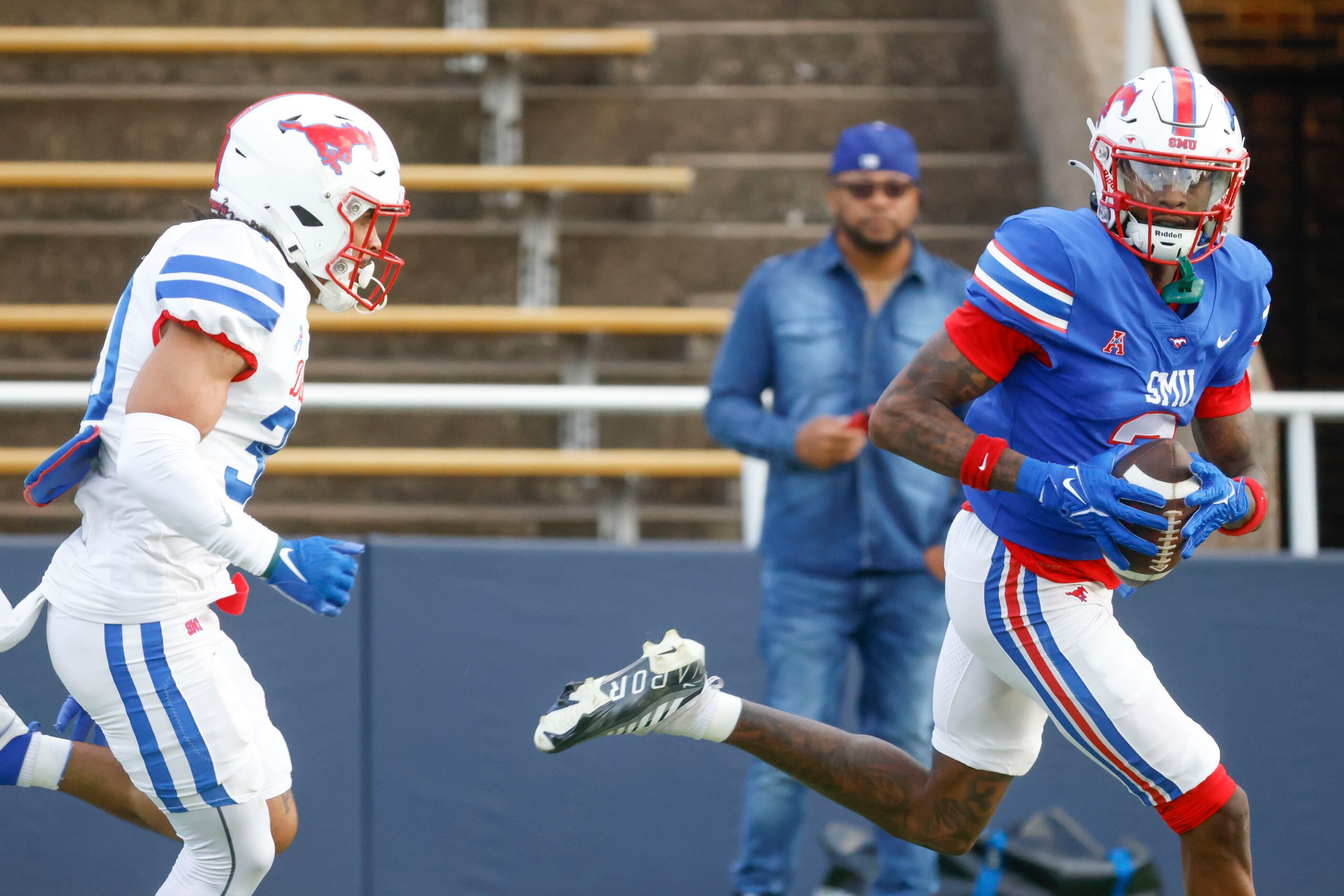 Southern Methodist’s  Nate Monticure (left) runs after Southern Methodist wide receiver...