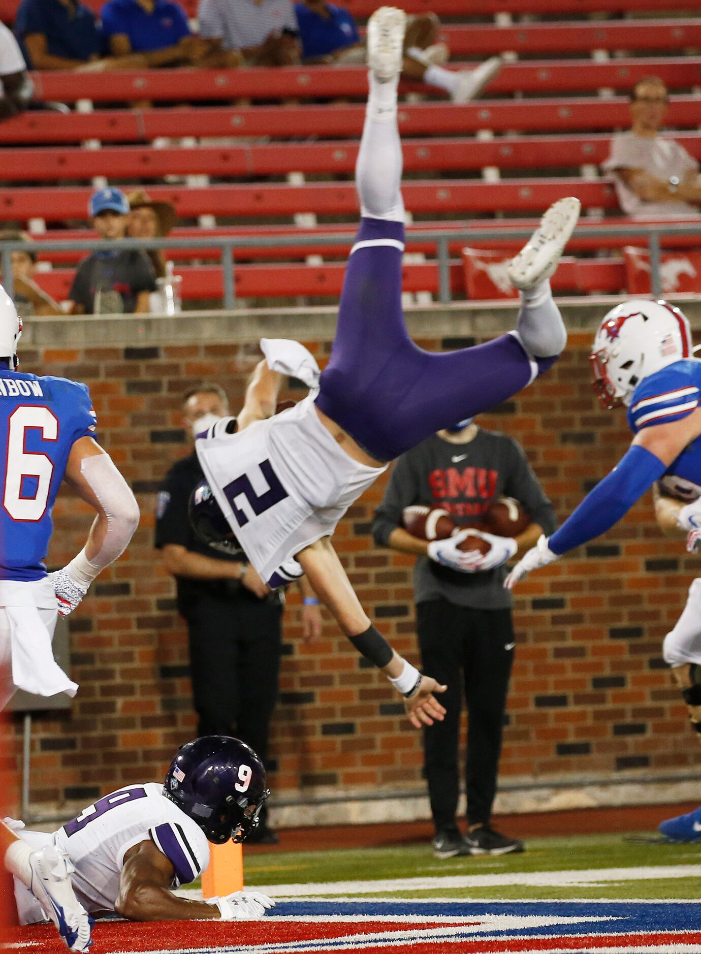 Stephen F. Austin Lumberjacks quarterback Trae Self (2) flips into the end zone for a...