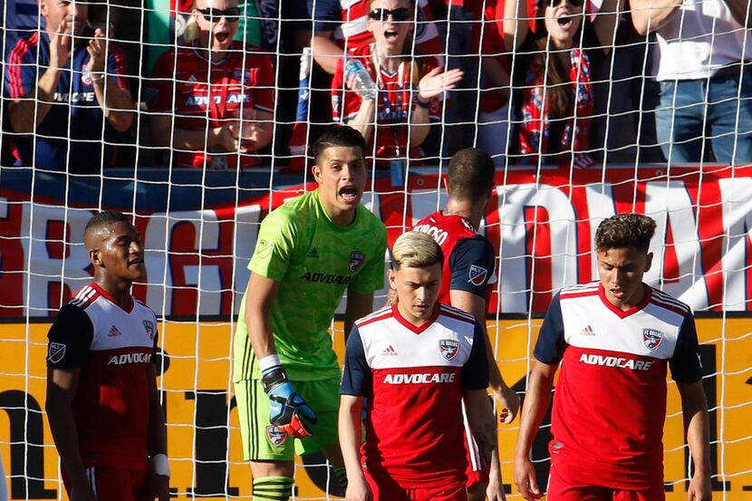 FC Dallas goal keeper Jesse Gonzalez (1) lets out a yell as he is backed by the approval of...