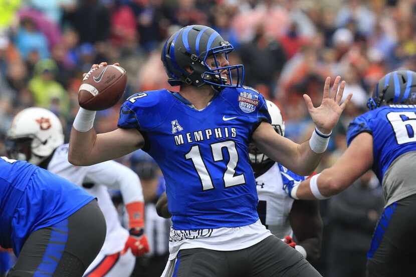 Memphis Tigers quarterback Paxton Lynch (12) drops back to pass against Auburn Tigers in the...