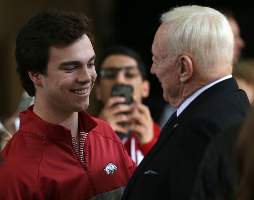 Dallas Cowboys owner Jerry Jones (right) greets his grandson John Stephen Jones, who is...