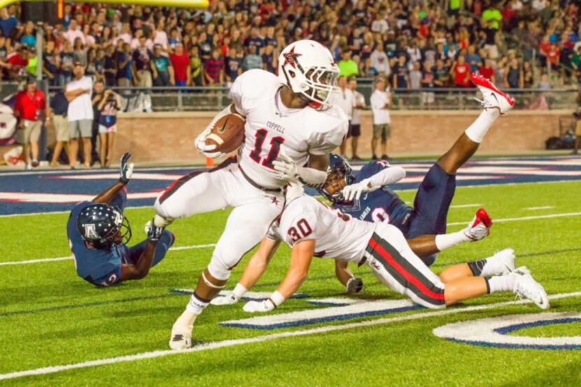 Coppell High School senior wide receiver Troy Parker (11) returns a kickoff 28 yards from...