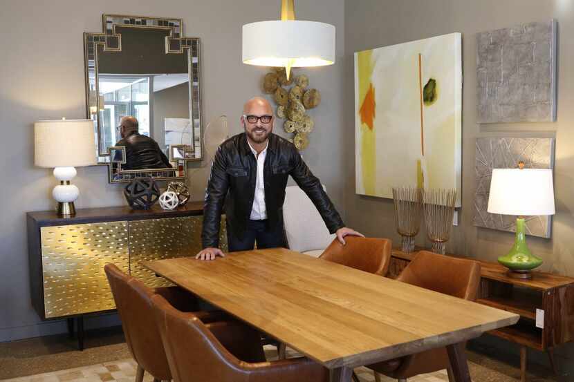 John Erdos, CEO of Erdos at Home, stands next to a Verona table and Miguel chairs in his new...