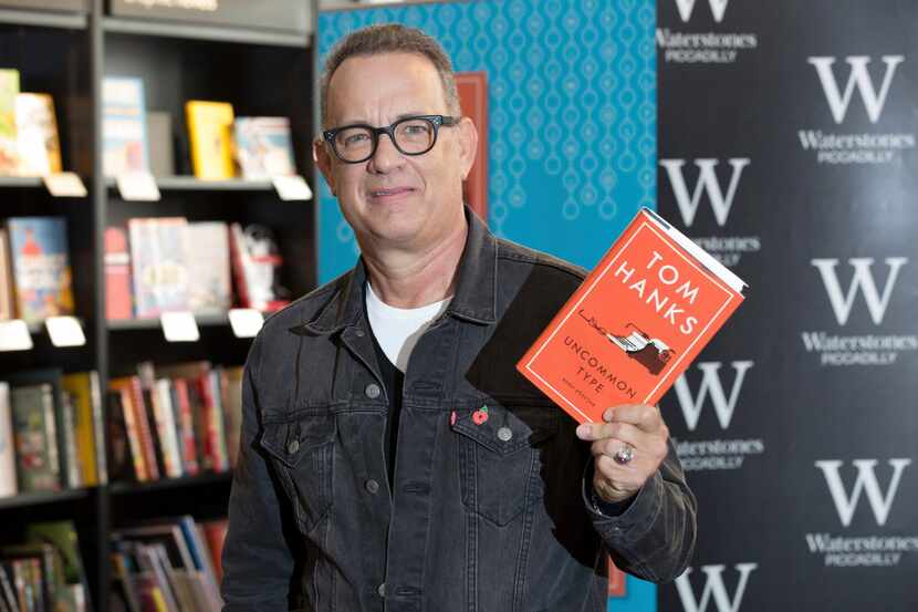 Actor Tom Hanks poses for photographers at a signing of his new book 'Uncommon Type', in...