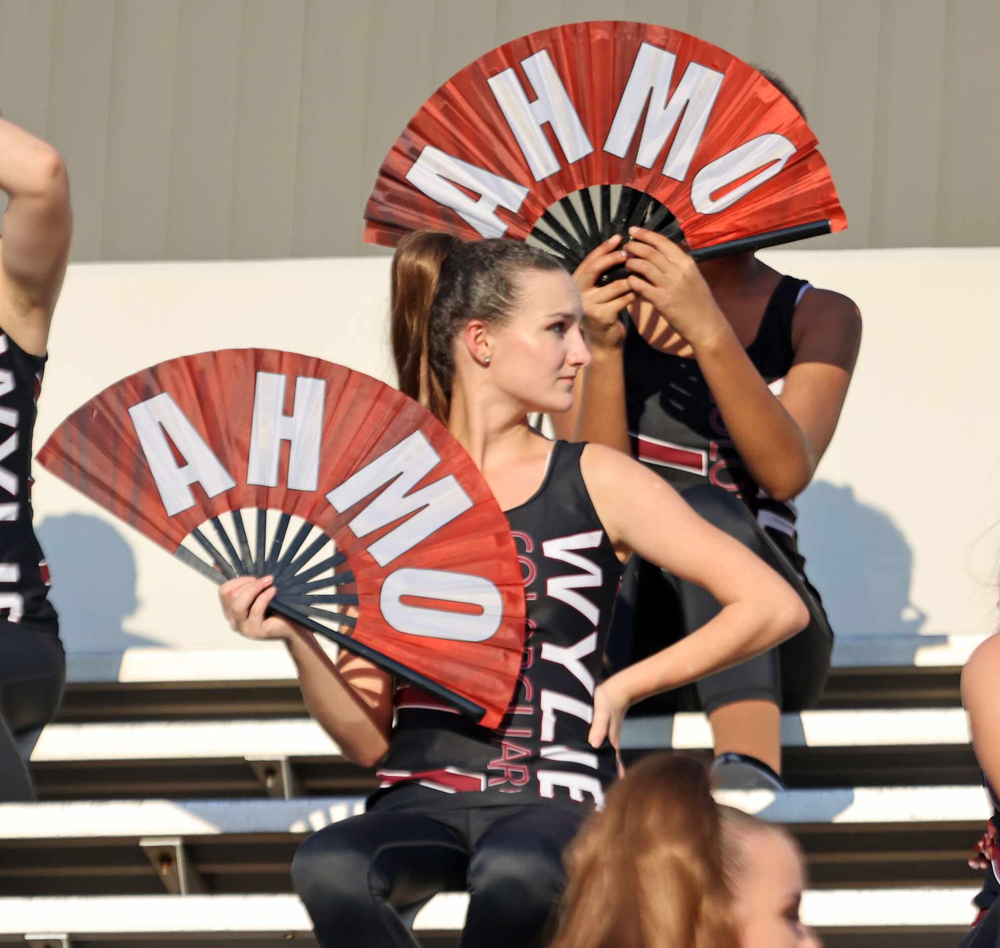 The Wylie High Flay Team flashes AMHO fans in the stands before the start of the first half...