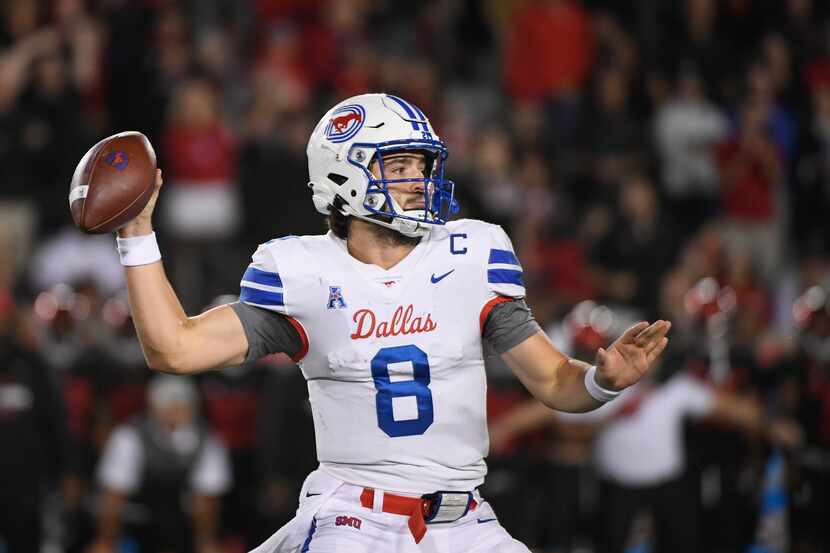 SMU quarterback Tanner Mordecai (8) throws the ball against Houston during the second half...