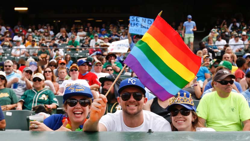 Fans celebrate Pride Weekend during the game between the Oakland Athletics and the Kansas...