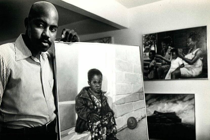 Dallas artist Arthello Beck Jr. posed with a portrait of his son in July 1979.