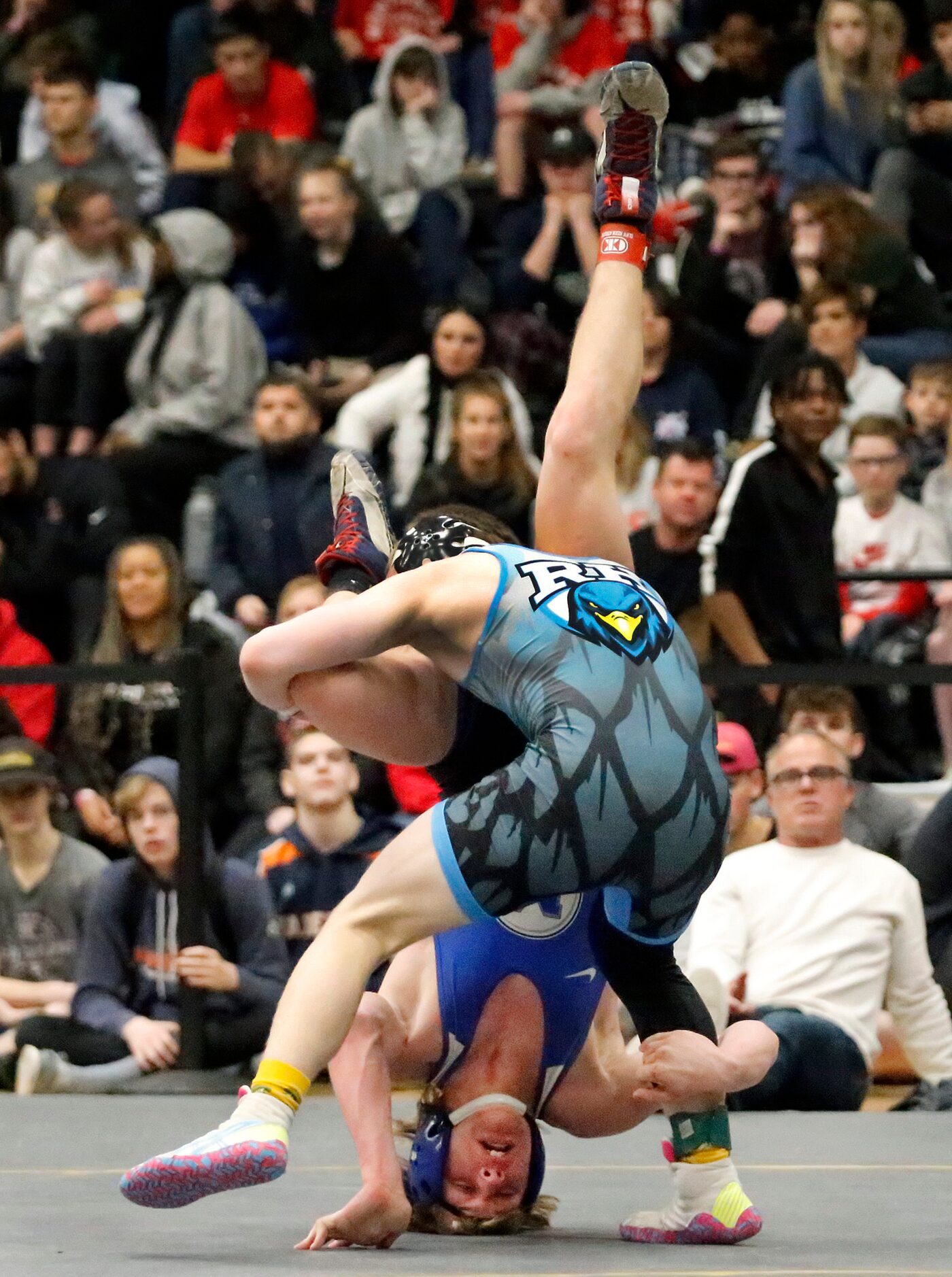 Xavier Jukes (front) of Prosper Rock Hill High School stands Nicholas Celli of Midlothian...