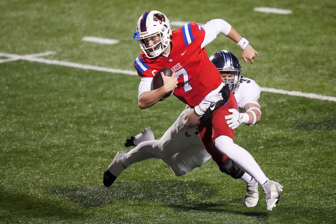 Parish Episcopal quarterback Sawyer Anderson (7) is brought down by Argyle Liberty Christian...