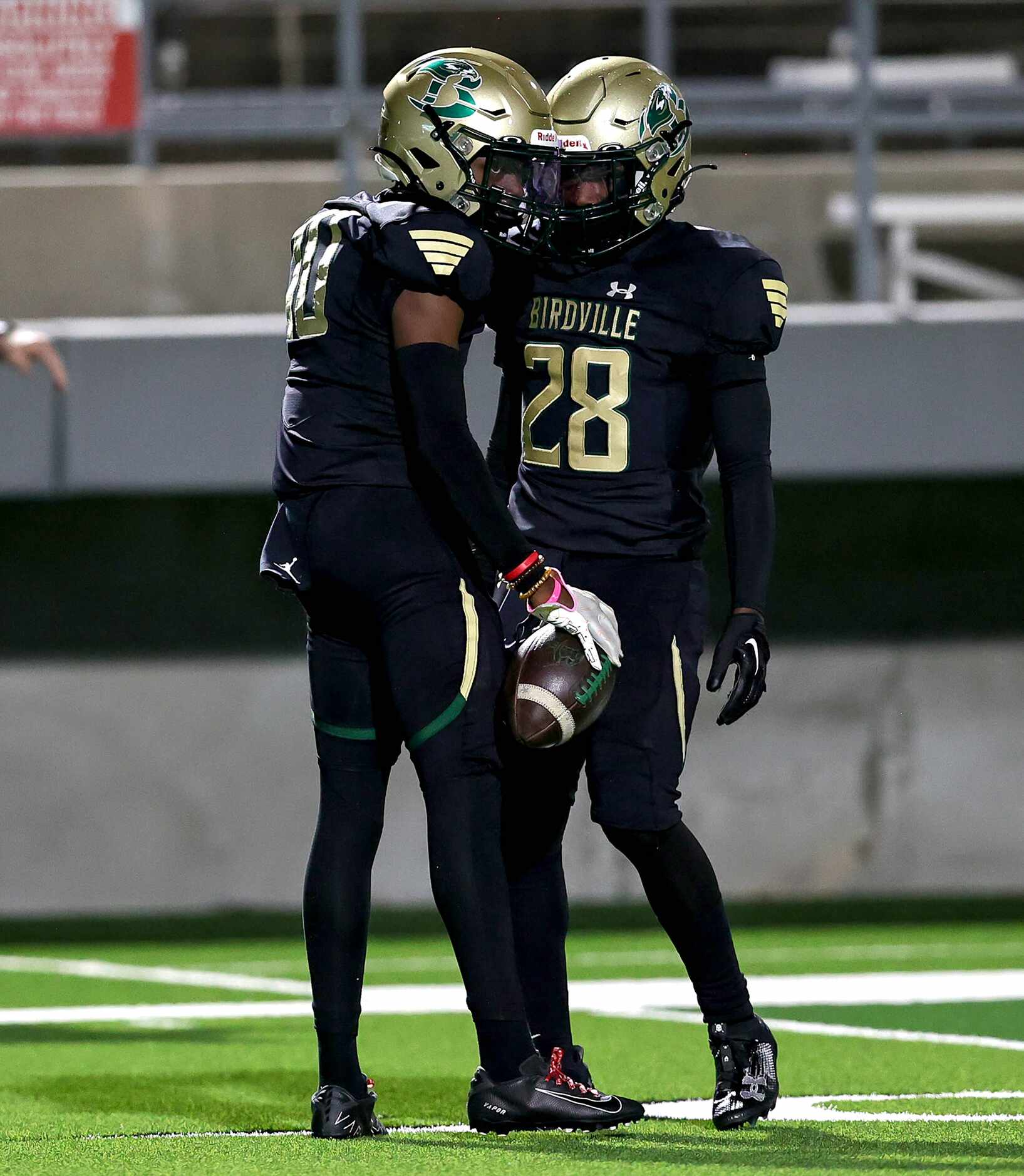 Birdville wide receiver Lamar Leggins (10) and running back Jamal Ramsey (28) celebrate...