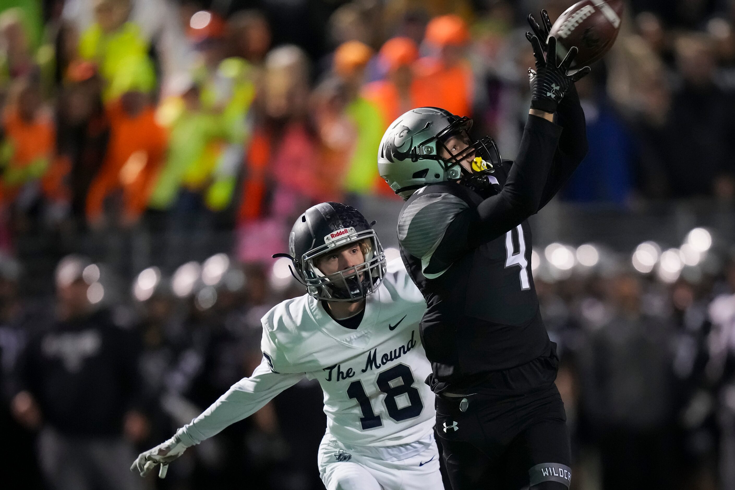 Denton Guyer wide receiver Brody Noble (4) hauls in a pass as Flower Mound cornerback Cooper...