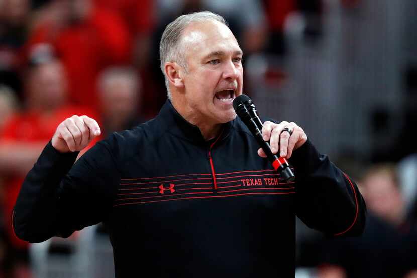 Texas Tech football coach Joey McGuire talks to the crowd during the halftime of an NCAA...