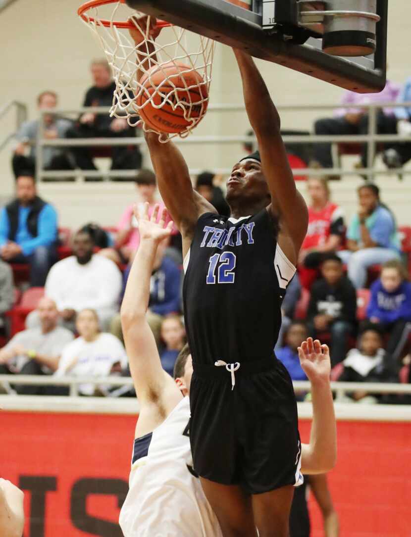 Trinity Christian-Cedar Hill's Tyreek Smith dunks against Second Baptist on March 2, 2018....